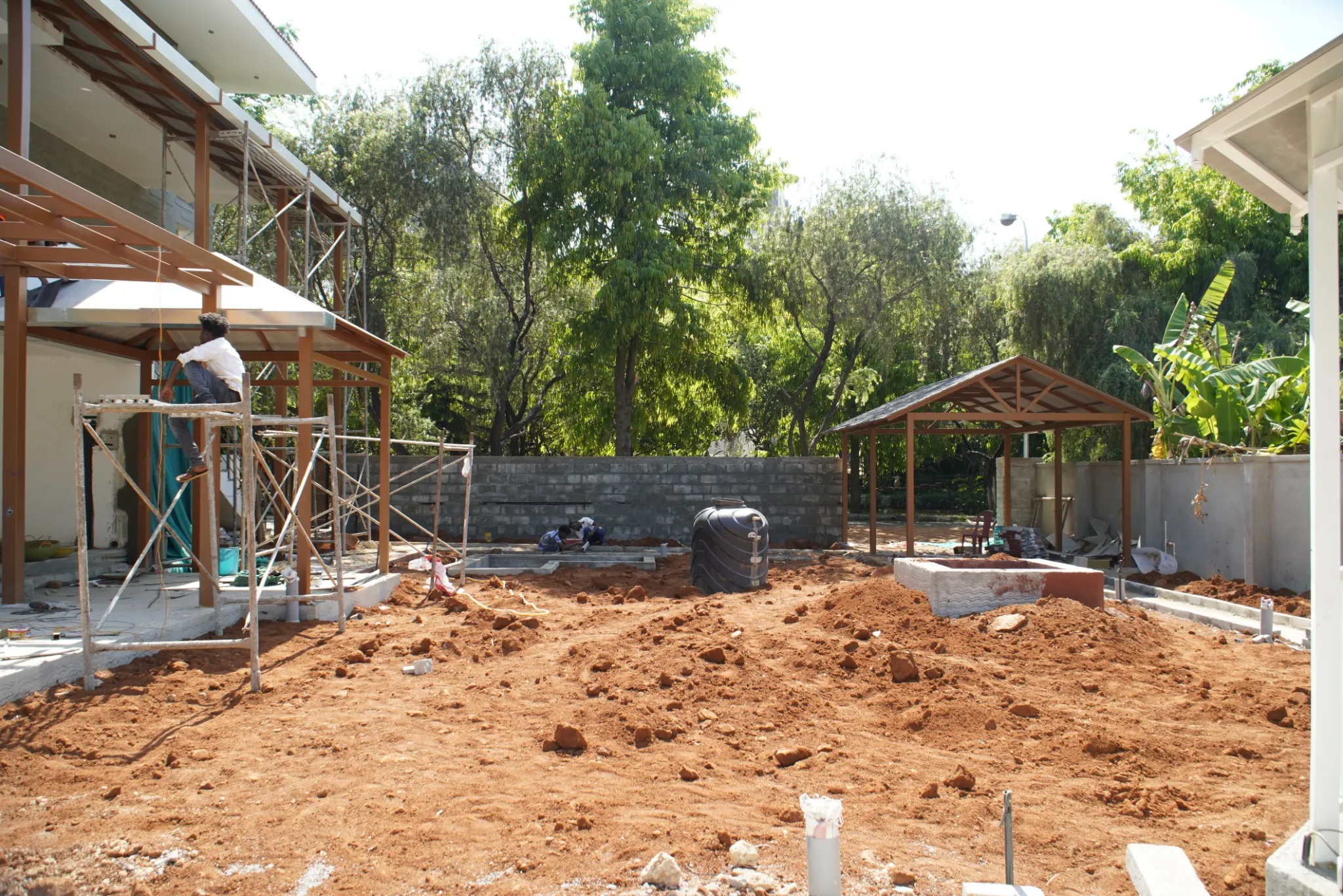 Pergola frames, roof structures and garden civil works under construction