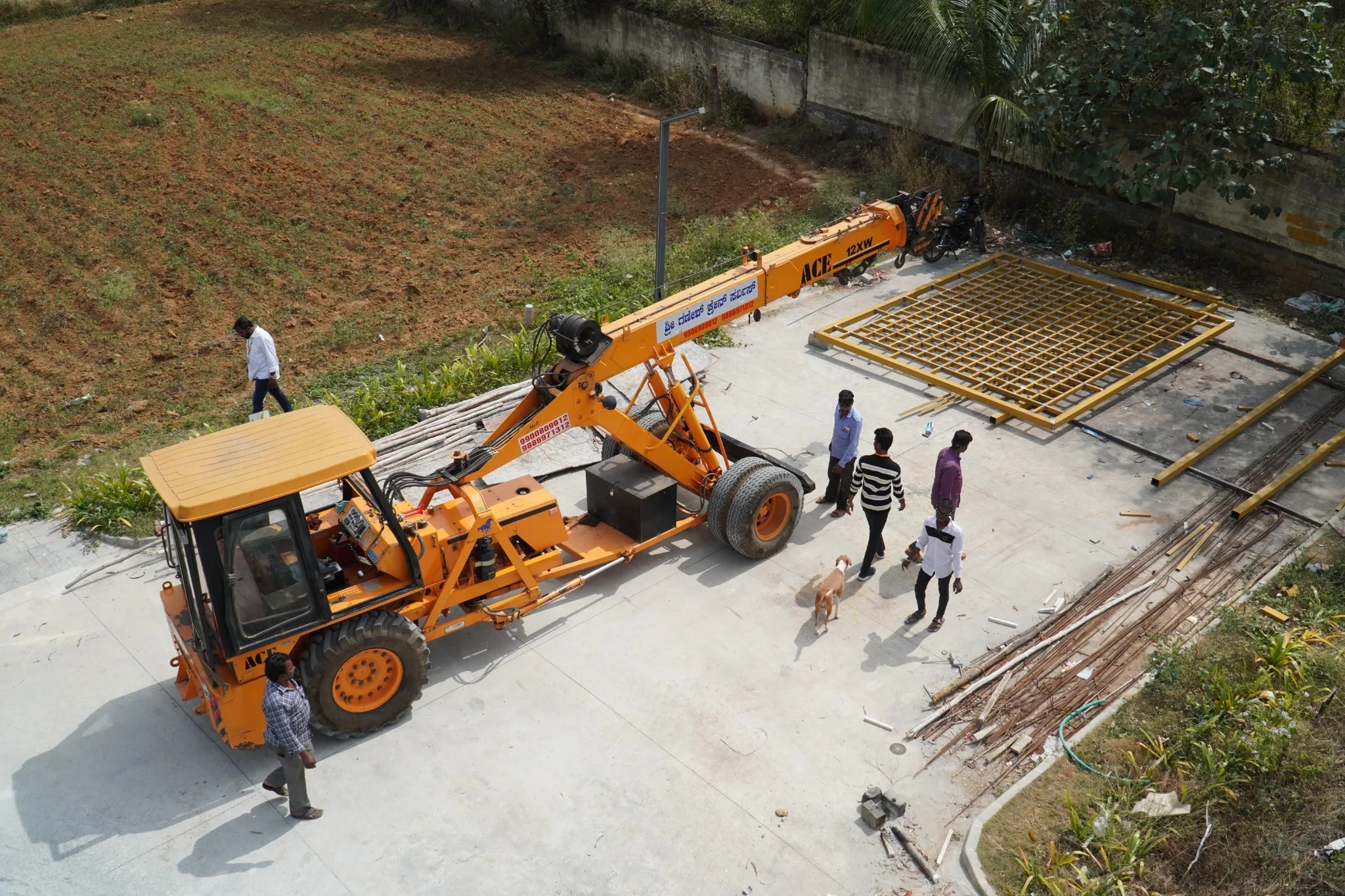 Site team preparing to lift a fabricated roof frame into position