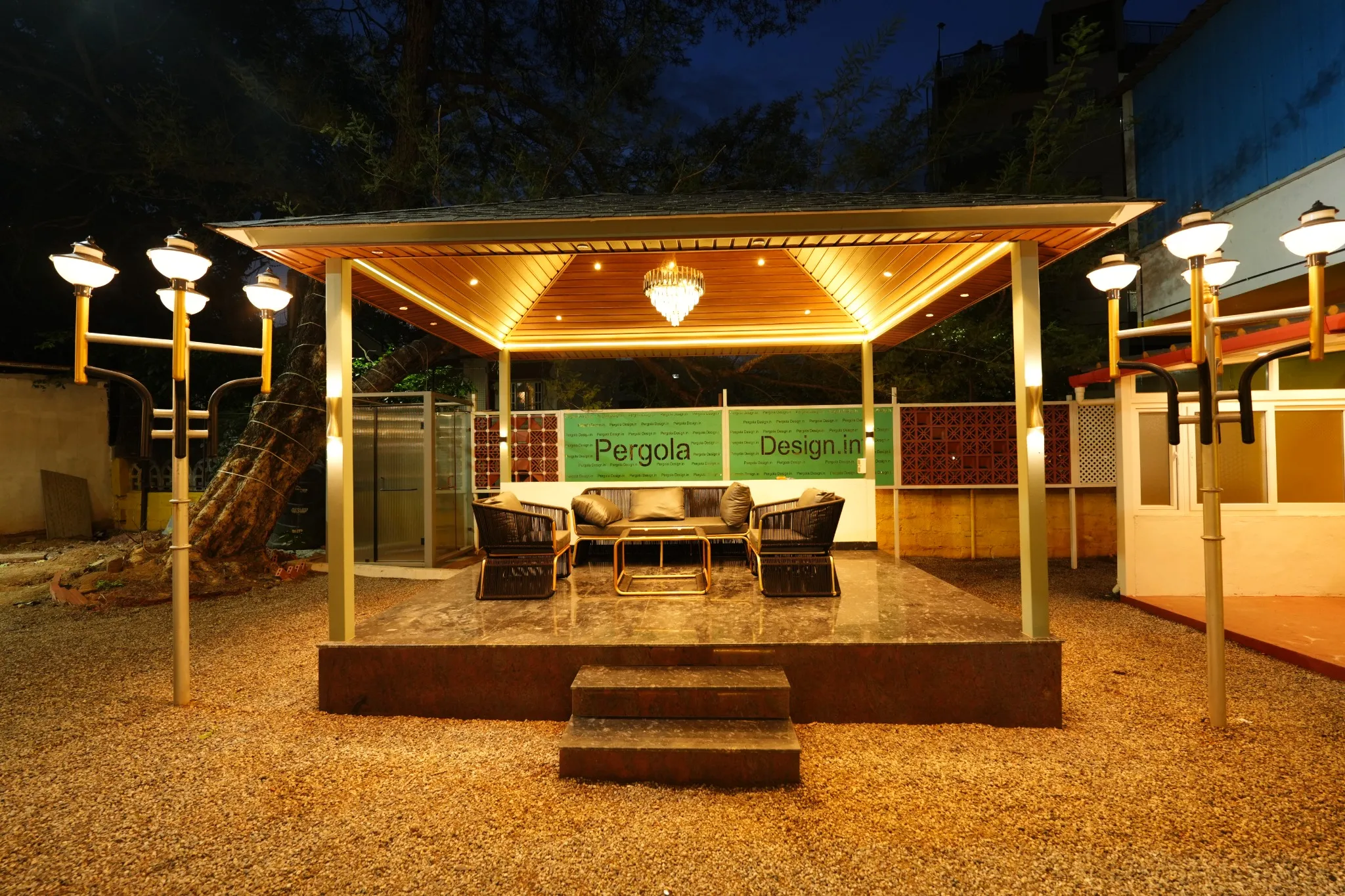 Warmly lit pergola seating display at the Experience Centre
