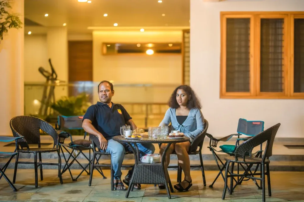 Warm lighting creates a comfortable setting for Mr Anand and his daughter.