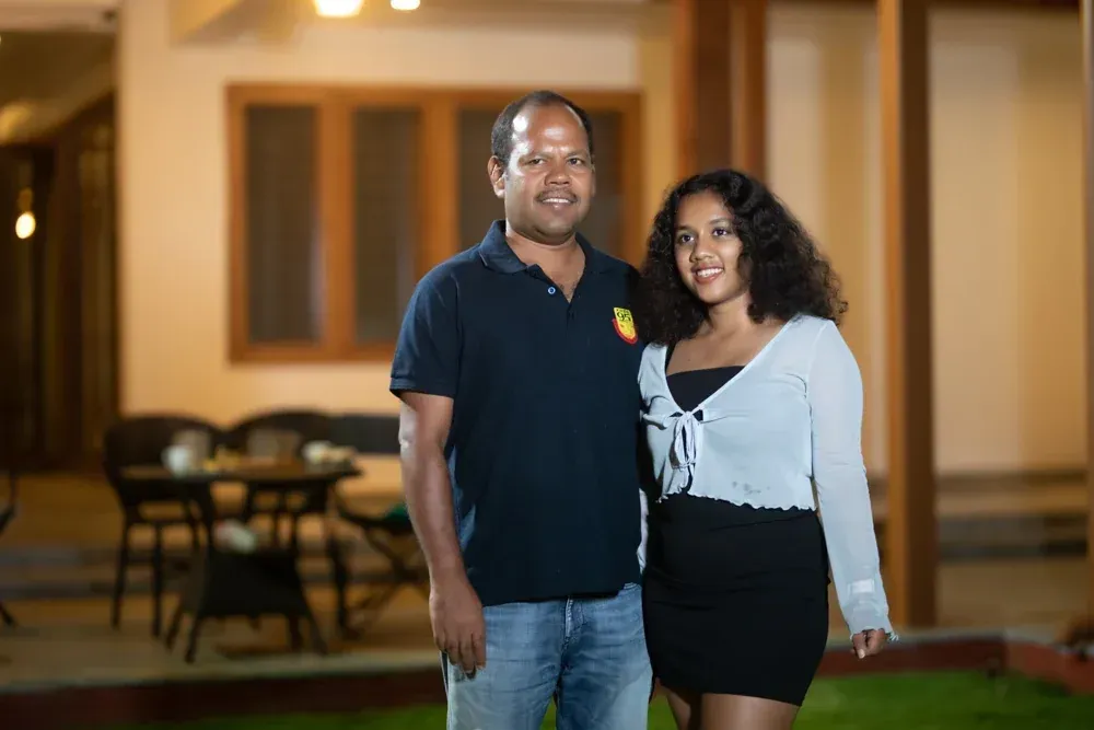 Mr Anand and his daughter together in the completed, warmly lit space.