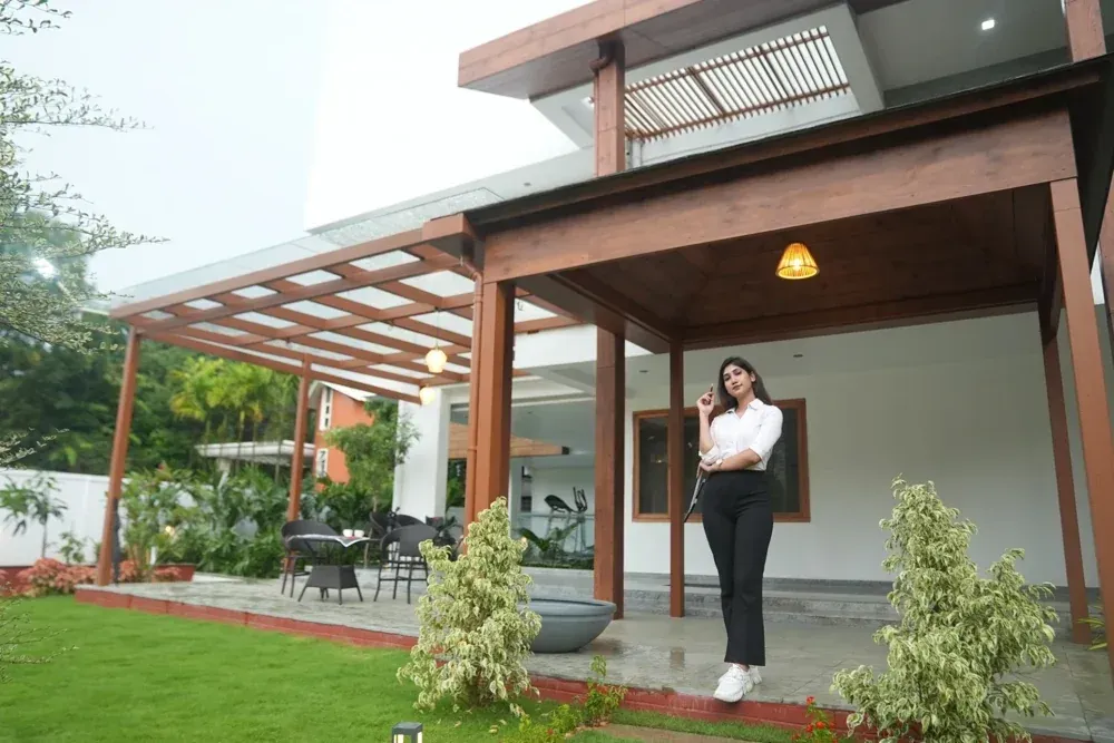 A moment at the finished entrance, with the pergola and garden in view.