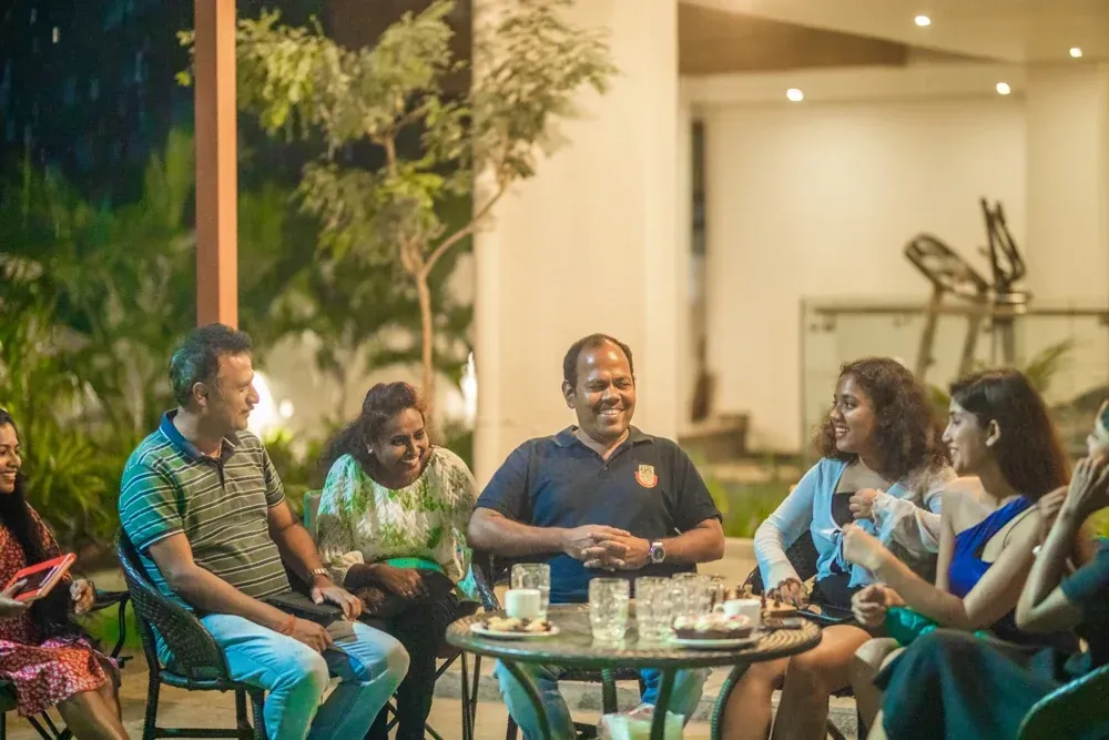 An evening gathering around the table in the completed outdoor space.
