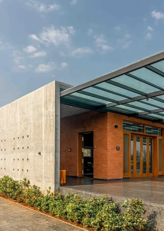 Glass entrance canopy above a modern building
