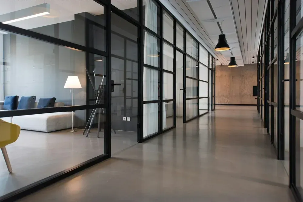 Interior glass partitions separating rooms while admitting daylight