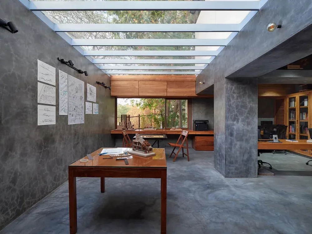 Interior space illuminated by an overhead glass skylight