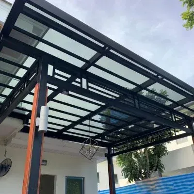 Exposed metal framework supporting an architectural roof
