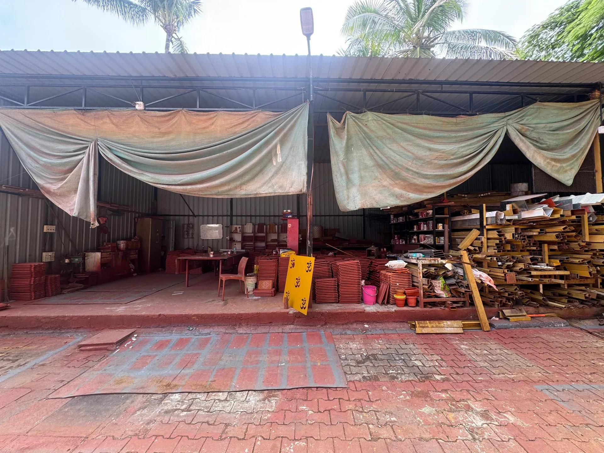 Covered fabrication workshop and material storage area
