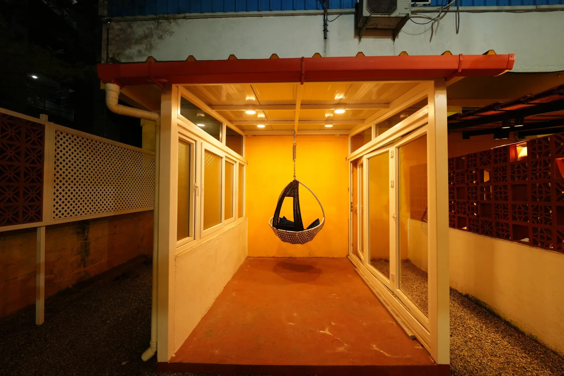 Covered passage display with a suspended swing and warm lighting