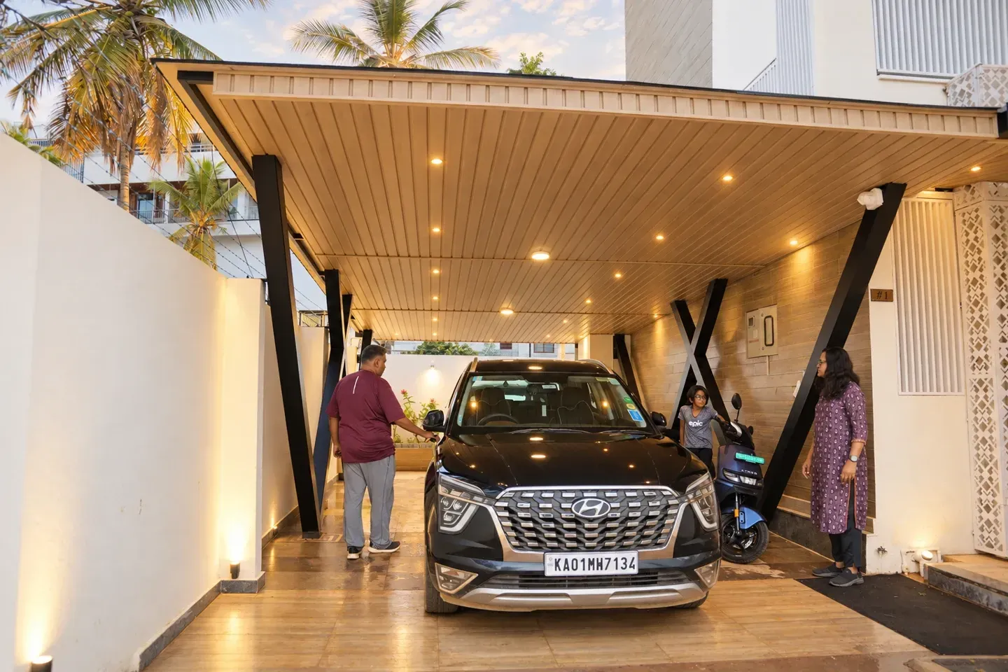 Enhanced front view of the covered parking area with a car, illuminated walls and decorative white screens