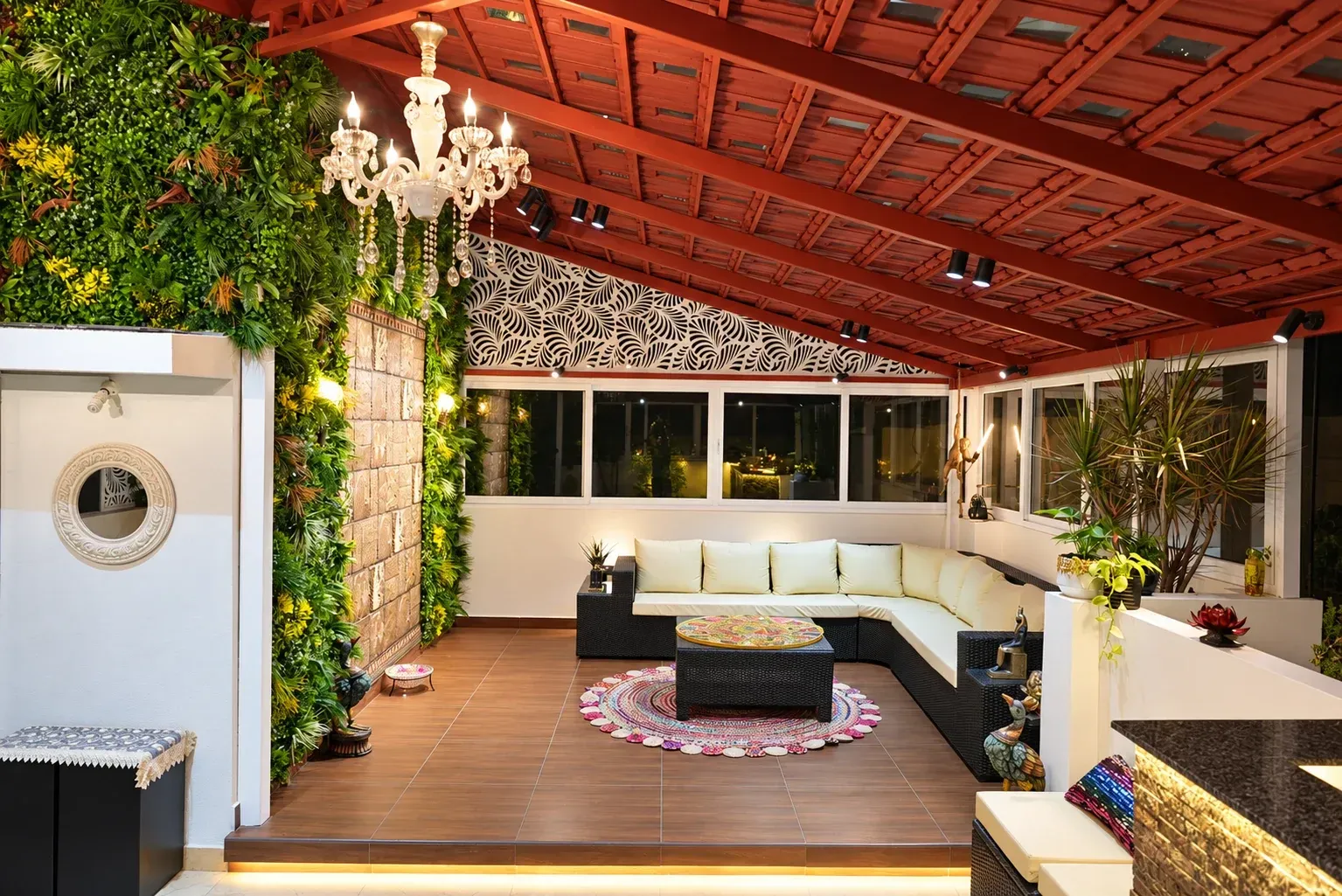 Completed Premium Mangalore tile pergola with a chandelier, green wall and lounge seating