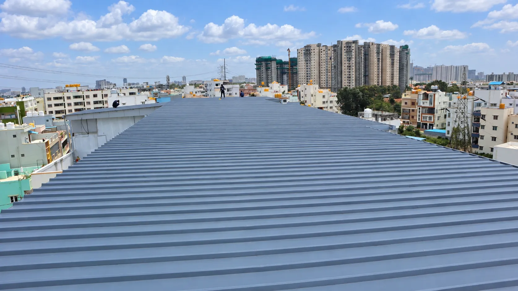 Completed PUF sheet roof installation overlooking the surrounding neighbourhood