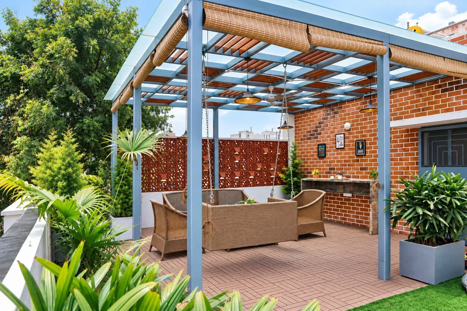 Premium Terrace pergola with jali privacy walls, roll-up blinds and a suspended outdoor swing