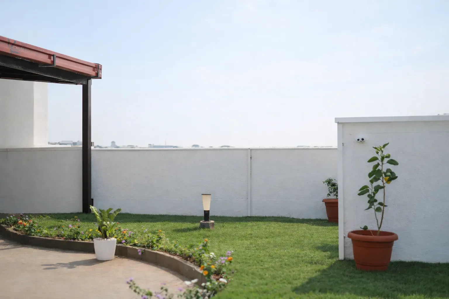 The same rooftop garden before PVC lattice panels were installed