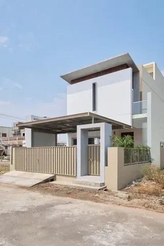 Front view of a residence with a sheltered parking area