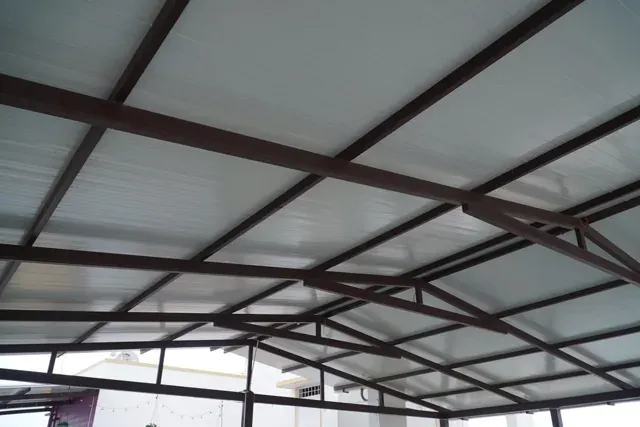 Close view of the white roofing underside and metal support structure