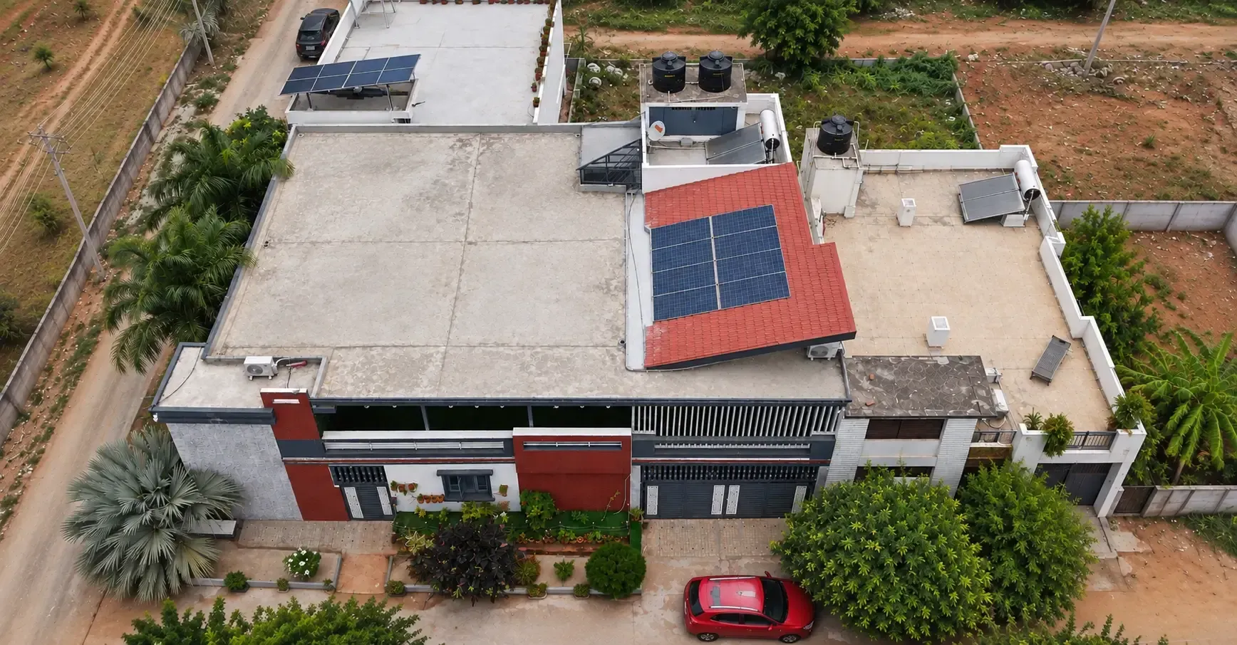 The same residential property before shingles roofing was added over the open terrace