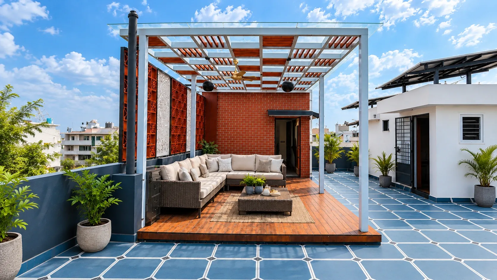 Completed rooftop pergola with lounge seating, a wooden deck and privacy screens