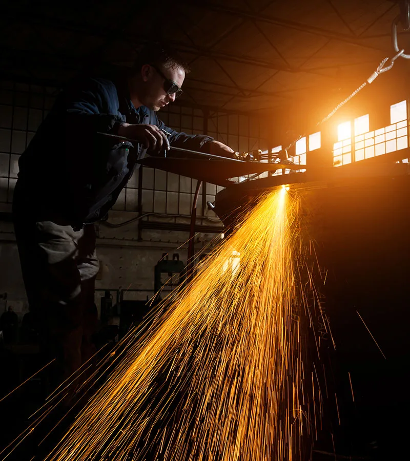 welder working at the factory 3ATMXRR 1